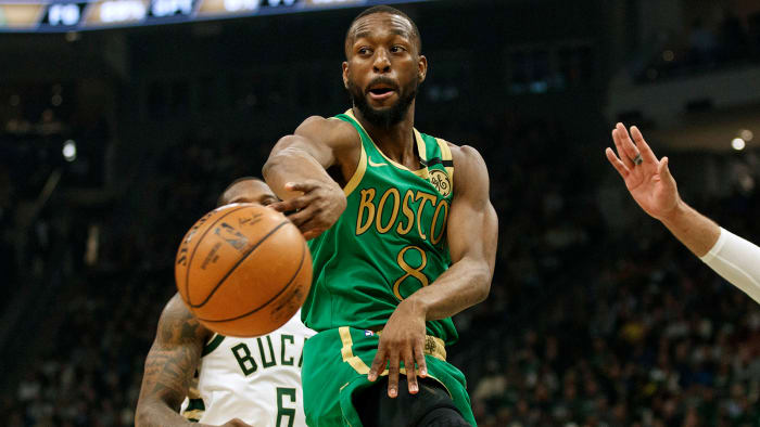 Kemba Walker passes the ball against the Milwaukee Bucks